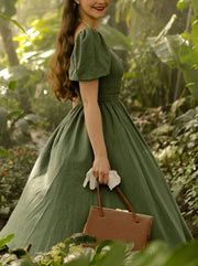 Vestido verde mangas abullonadas escote tipo Reina Ana
