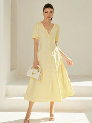 Vestido largo de rayas con escote en V y mangas abullonadas